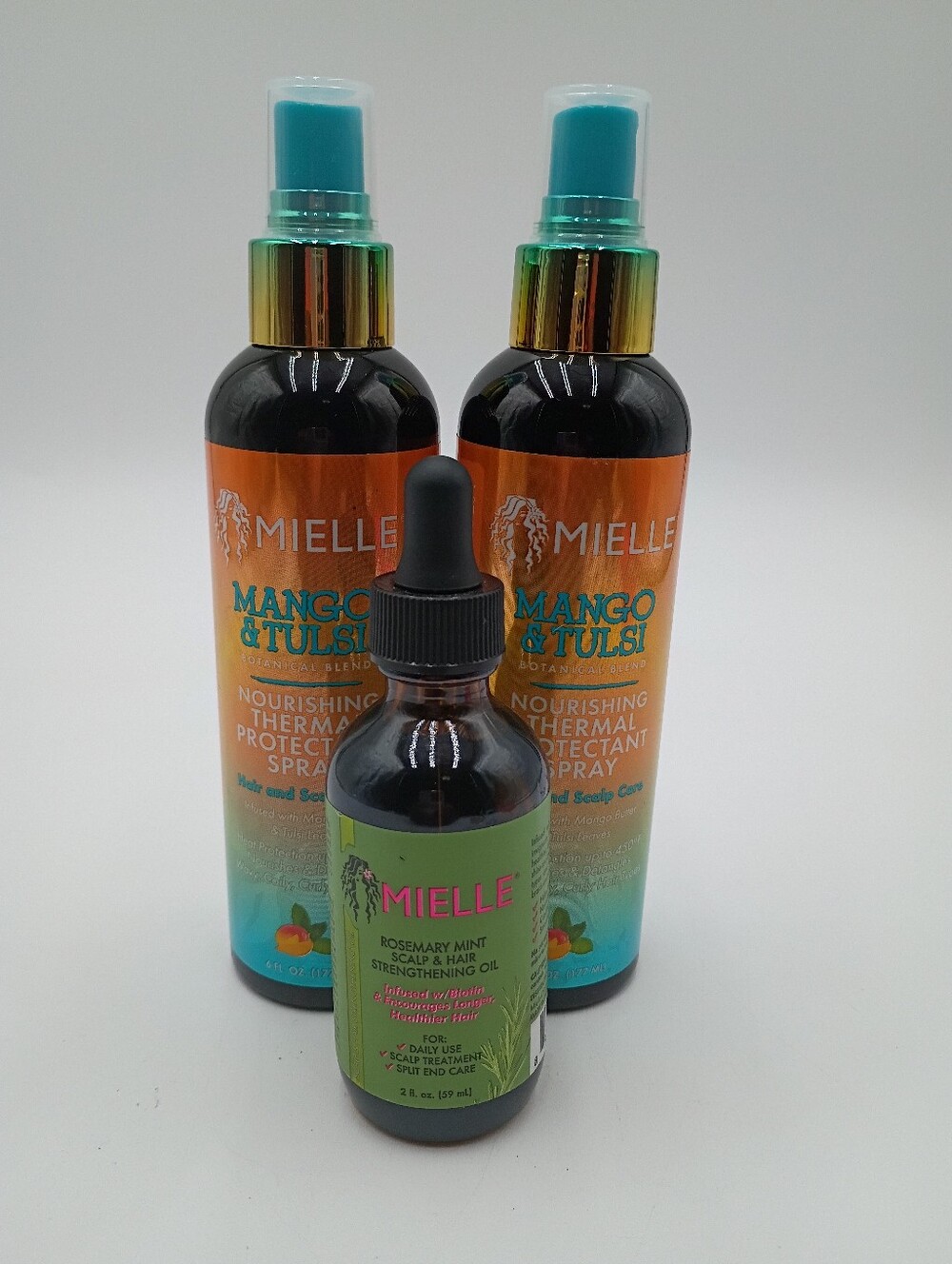 Mielle Haircare Scalp & Hair Strengthening Oil And Thermal Protectant Spray.